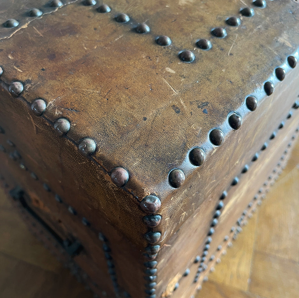 A stunning leather clad and brass studded Wine Chest with a great aged look, wear and colour. It has a hinged and barrel top with sturdy brass handle on each side. Inside sees an inner metal bin with handy handles making it easy to remove. Will hold 12 bottles of wine - SHOP NOW - www.intovintage.co.uk