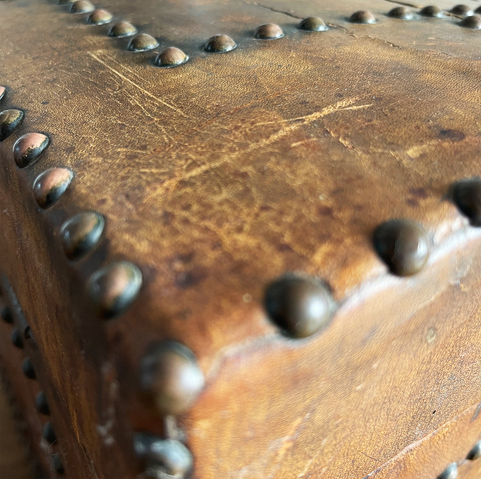 A stunning leather clad and brass studded Wine Chest with a great aged look, wear and colour. It has a hinged and barrel top with sturdy brass handle on each side. Inside sees an inner metal bin with handy handles making it easy to remove. Will hold 12 bottles of wine - SHOP NOW - www.intovintage.co.uk