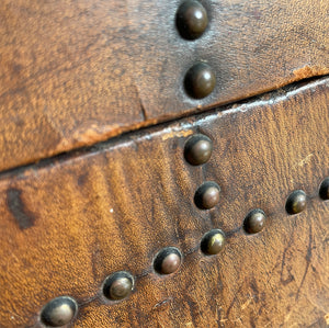 A stunning leather clad and brass studded Wine Chest with a great aged look, wear and colour. It has a hinged and barrel top with sturdy brass handle on each side. Inside sees an inner metal bin with handy handles making it easy to remove. Will hold 12 bottles of wine - SHOP NOW - www.intovintage.co.uk
