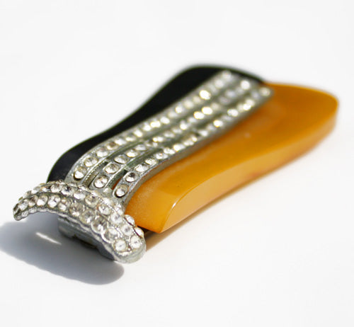 A magnificent art deco dress clip topped with diamantes. The duo colour base is topped with diamantes set in silvertone metal. It can be clipped to a dress or coat to add instant deco glamour - SHOP NOW - www.intovintage.co.uk