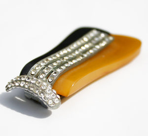 A magnificent art deco dress clip topped with diamantes. The duo colour base is topped with diamantes set in silvertone metal. It can be clipped to a dress or coat to add instant deco glamour - SHOP NOW - www.intovintage.co.uk