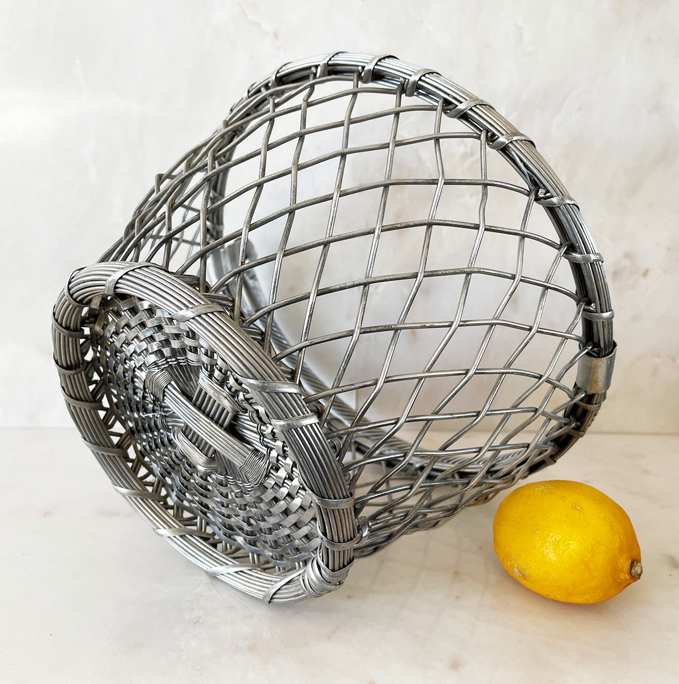 A Vintage Basket. Made of aluminium wire making it very sturdy. Use it for fruit or, line it with a smart napkin and serve some rustic bread in it - SHOP NOW - www.intovintage.co.uk