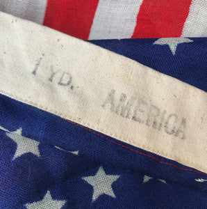 Vintage American Flag that has never been used so super fresh! Great strong red & blue colours. Marked '1 YD AMERICA' on the seem. These flags look great framed and hung on the wall - SHOP NOW - www.intovintage.co.uk
