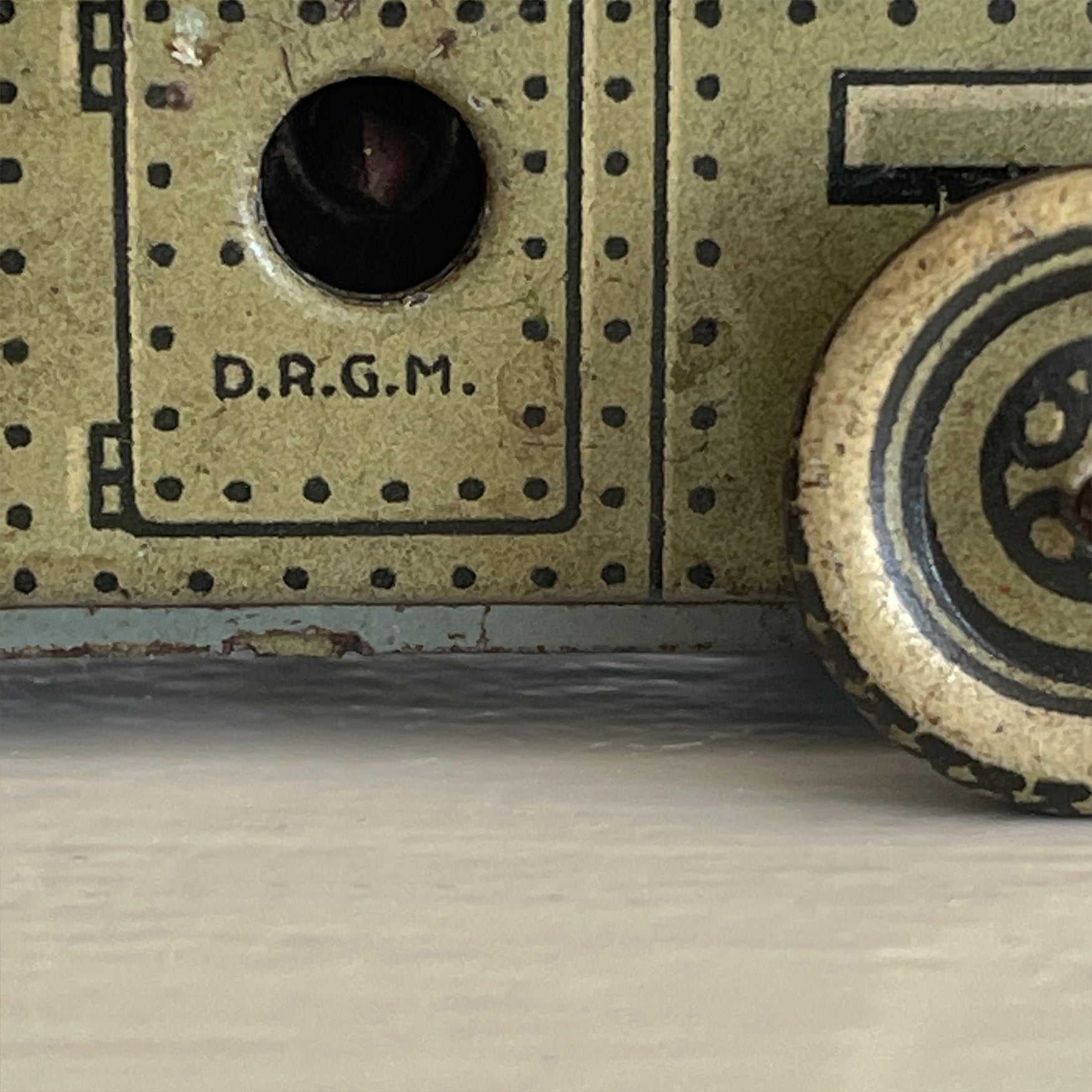 A Cool little Pre-War 1930s Kellerman tin-plate clockwork Panzerspahwagen Armoured Car. It has a clockwork movement, that when wound propels the car forward and shoots bright sparks out of the gun turret. Marked 'D.R.G.M' just under the key hole and 'FOREIGN' above the front wheel - SHOP NOW - www.intovintage.co.uk