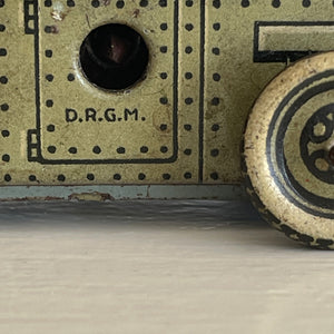 A Cool little Pre-War 1930s Kellerman tin-plate clockwork Panzerspahwagen Armoured Car. It has a clockwork movement, that when wound propels the car forward and shoots bright sparks out of the gun turret. Marked 'D.R.G.M' just under the key hole and 'FOREIGN' above the front wheel - SHOP NOW - www.intovintage.co.uk