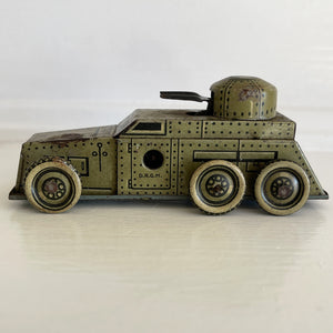A Cool little Pre-War 1930s Kellerman tin-plate clockwork Panzerspahwagen Armoured Car. It has a clockwork movement, that when wound propels the car forward and shoots bright sparks out of the gun turret. Marked 'D.R.G.M' just under the key hole and 'FOREIGN' above the front wheel - SHOP NOW - www.intovintage.co.uk