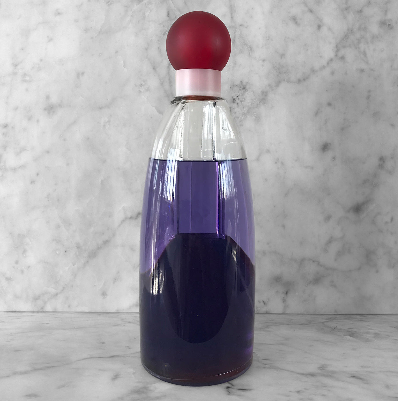 Super large Vintage Factise Bottle for Benetton Tribu. Filled with coloured water, this big bottle would have used for display at a perfume counter or shop window. A great piece to display in the bathroom or on the dressing table - SHOP NOW - www.intovintage.co.uk