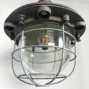 Very original, very heavy, Vintage GEC Blast Lamp. Marked 'G.E.C. Made in England by The General Electric Co Ltd of England'. The top section is in a thick casted iron with an incredibly thick glass dome. The dome is protected by a heavy gauge wired frame - SHOP NOW - www.intovintage.co.uk