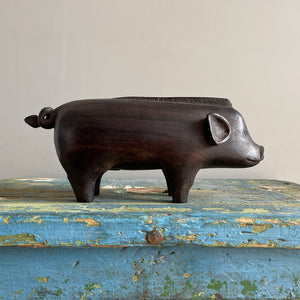 A superb tribal carving of a wild boar. He has a fantastic strong look to him, with a Mohican like mane, super curly tail with snakes head detail carved in. A very fine specimen! SHOP NOW - www.intovintage.co.uk