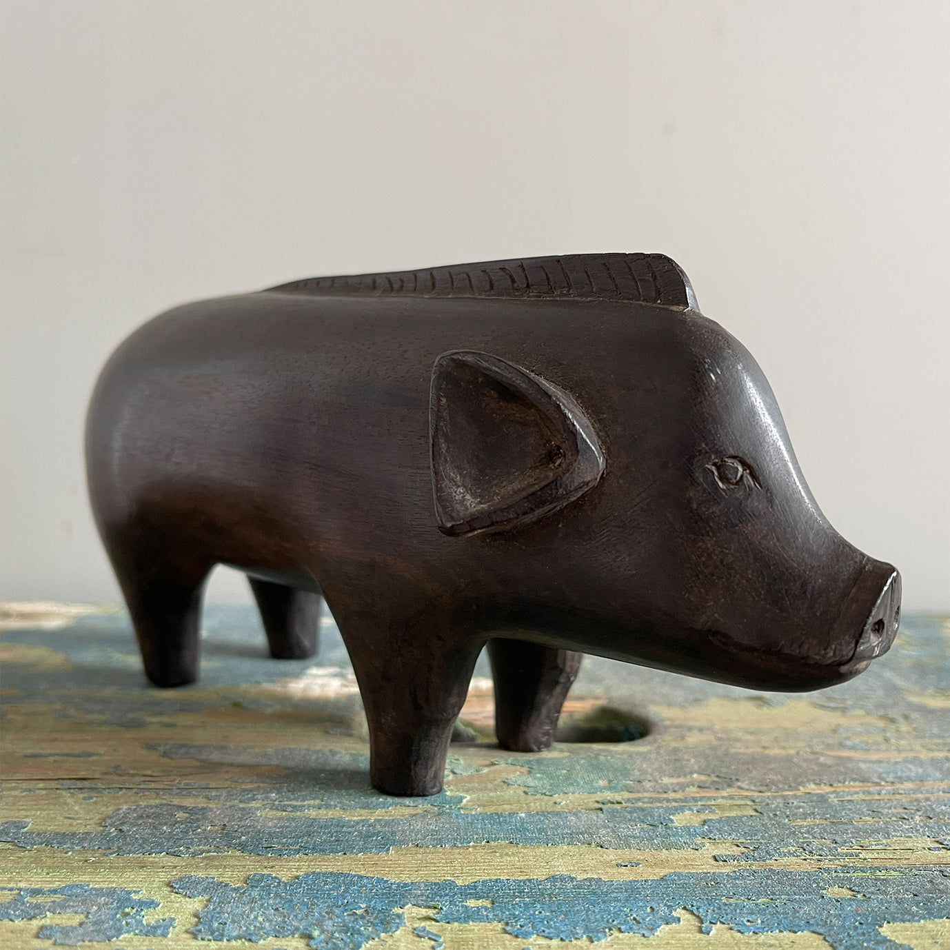 A superb tribal carving of a wild boar. He has a fantastic strong look to him, with a Mohican like mane, super curly tail with snakes head detail carved in. A very fine specimen! SHOP NOW - www.intovintage.co.uk