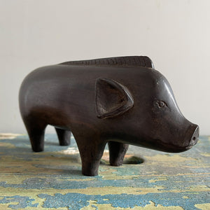 A superb tribal carving of a wild boar. He has a fantastic strong look to him, with a Mohican like mane, super curly tail with snakes head detail carved in. A very fine specimen! SHOP NOW - www.intovintage.co.uk