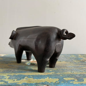 A superb tribal carving of a wild boar. He has a fantastic strong look to him, with a Mohican like mane, super curly tail with snakes head detail carved in. A very fine specimen! SHOP NOW - www.intovintage.co.uk