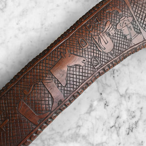 Wonderfully carved Antique Australian Boomerang with amazing naive carving and a beautiful warm colour. On the right side the carved elements include 2 emus, a cockerel, a turkey, a peacock a pea hen and a thistle, whilst on the left side we have a chap smoking a pipe, a knife, a cap, riding boots, pipe, horse, saddle, stirrups, hand cuffs, revolver, and Australian in an army hat. The background has a crosshatch design whilst the edge is finished in a carved dotted pattern - SHOP NOW - www.intovintage.co.uk