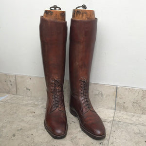 Pair of Antique British Army Officers Cavalry Boots in wonderful condition. Finished in brown leather with laces to the bottom section of the boot and leather soles. Each boot has its original wooden stave with the Faulkner & Son makers mark and topped off with a sturdy brass pull ring - SHOP NOW - www.intovintage.co.uk
