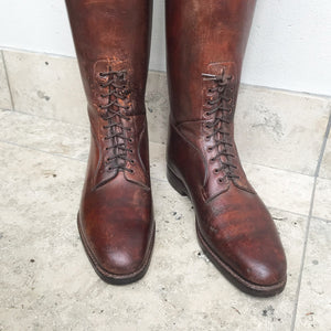 Pair of Antique British Army Officers Cavalry Boots in wonderful condition. Finished in brown leather with laces to the bottom section of the boot and leather soles. Each boot has its original wooden stave with the Faulkner & Son makers mark and topped off with a sturdy brass pull ring - SHOP NOW - www.intovintage.co.uk