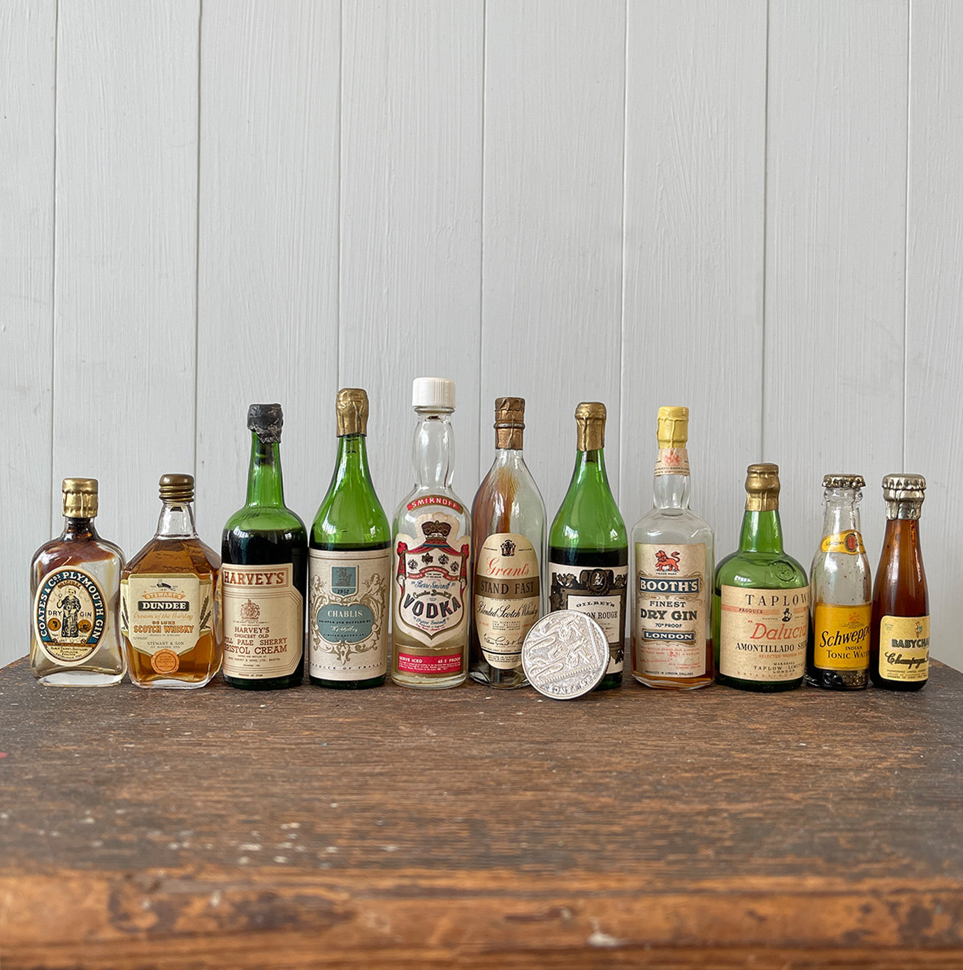 11 mini bottles of vintage Alcohol brands. Not drinkable, but great little display pieces! Brands include Babycham, Smirnoff, Coates & Co, Harvey's, Grants, Booths, Schweppes and Taplow - SHOP NOW - www.intovintage.co.uk