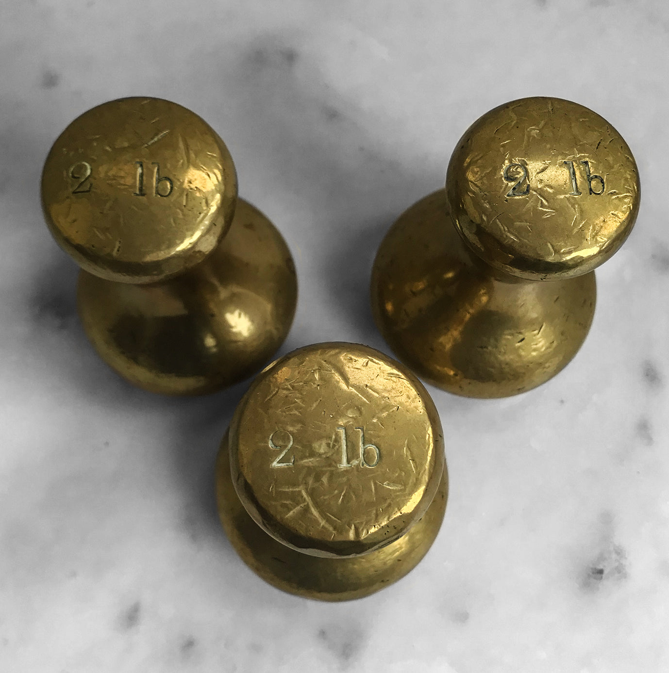 Set of 3 2lb Antique Brass Capstan Bell Weights that have a great patina to their surface. One is marked with the the Royal ER 177 mark on it's base - SHOP NOW - www.intovintage.co.uk