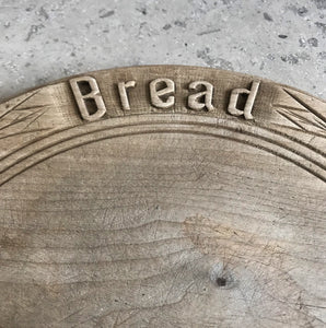 Neat mid 20th c breadboard with the word 'Bread' nice and sharply carved at the head of the board, with simple carved detail to the edge - SHOP NOW - www.intovintage.co.uk