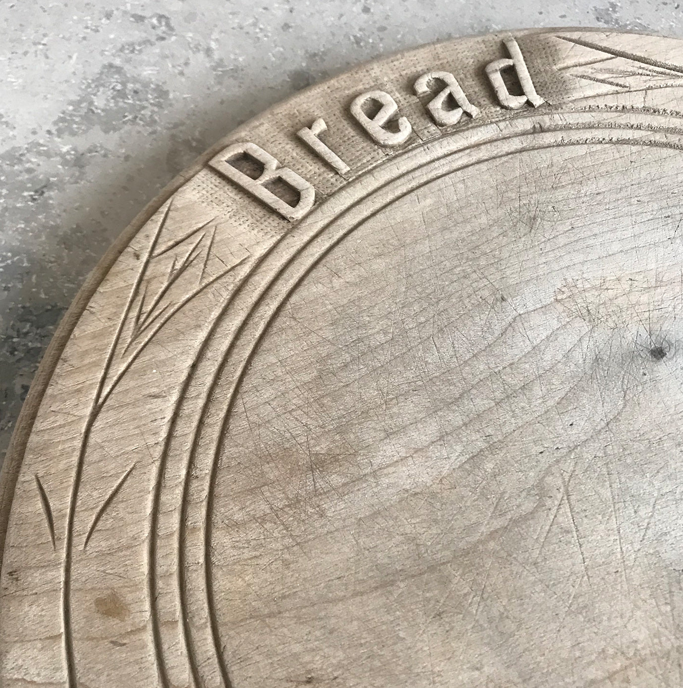 Neat mid 20th c breadboard with the word 'Bread' nice and sharply carved at the head of the board, with simple carved detail to the edge - SHOP NOW - www.intovintage.co.uk