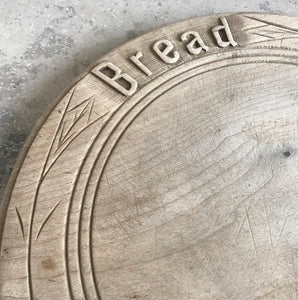 Neat mid 20th c breadboard with the word 'Bread' nice and sharply carved at the head of the board, with simple carved detail to the edge - SHOP NOW - www.intovintage.co.uk