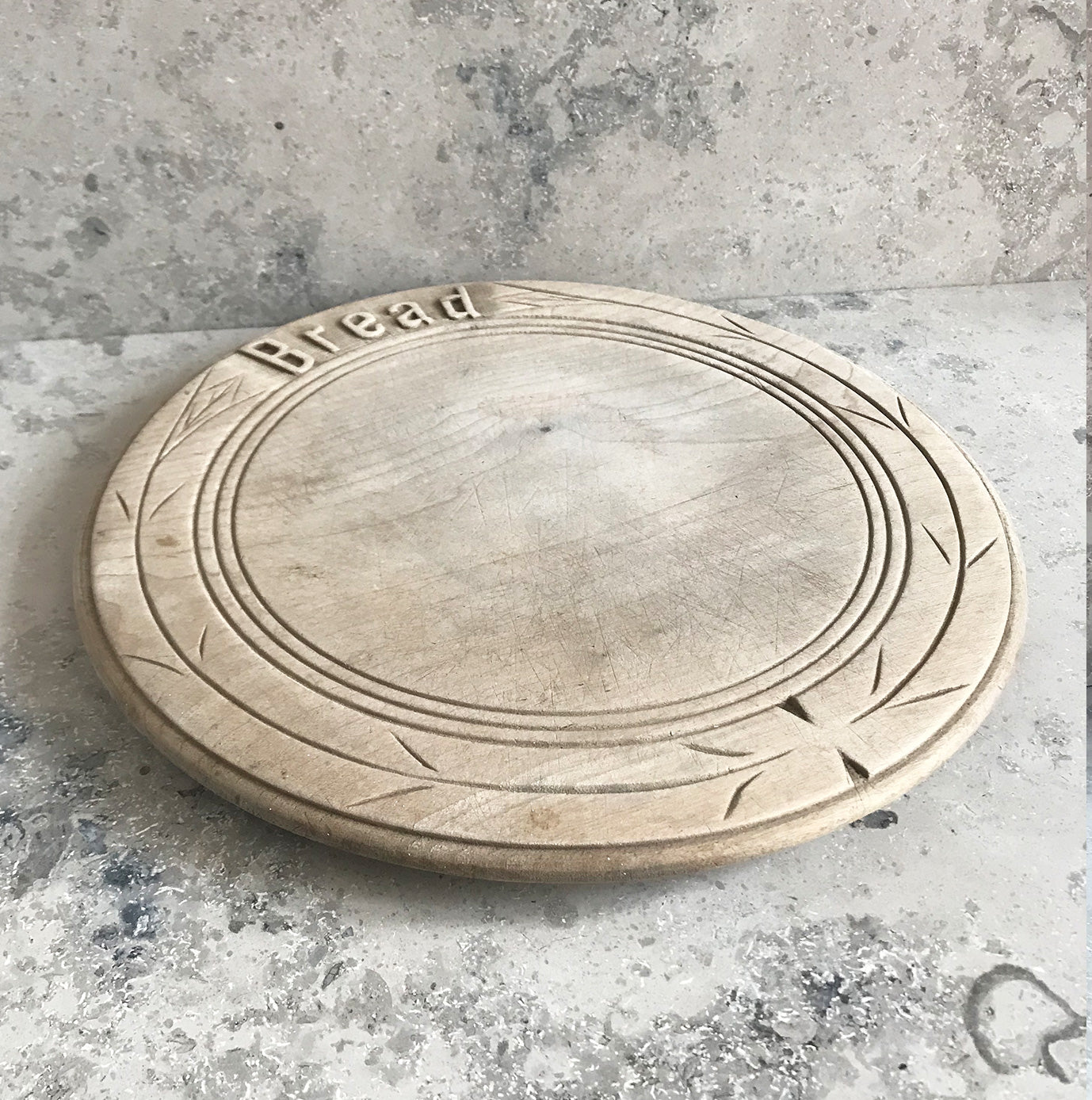 Neat mid 20th c breadboard with the word 'Bread' nice and sharply carved at the head of the board, with simple carved detail to the edge - SHOP NOW - www.intovintage.co.uk