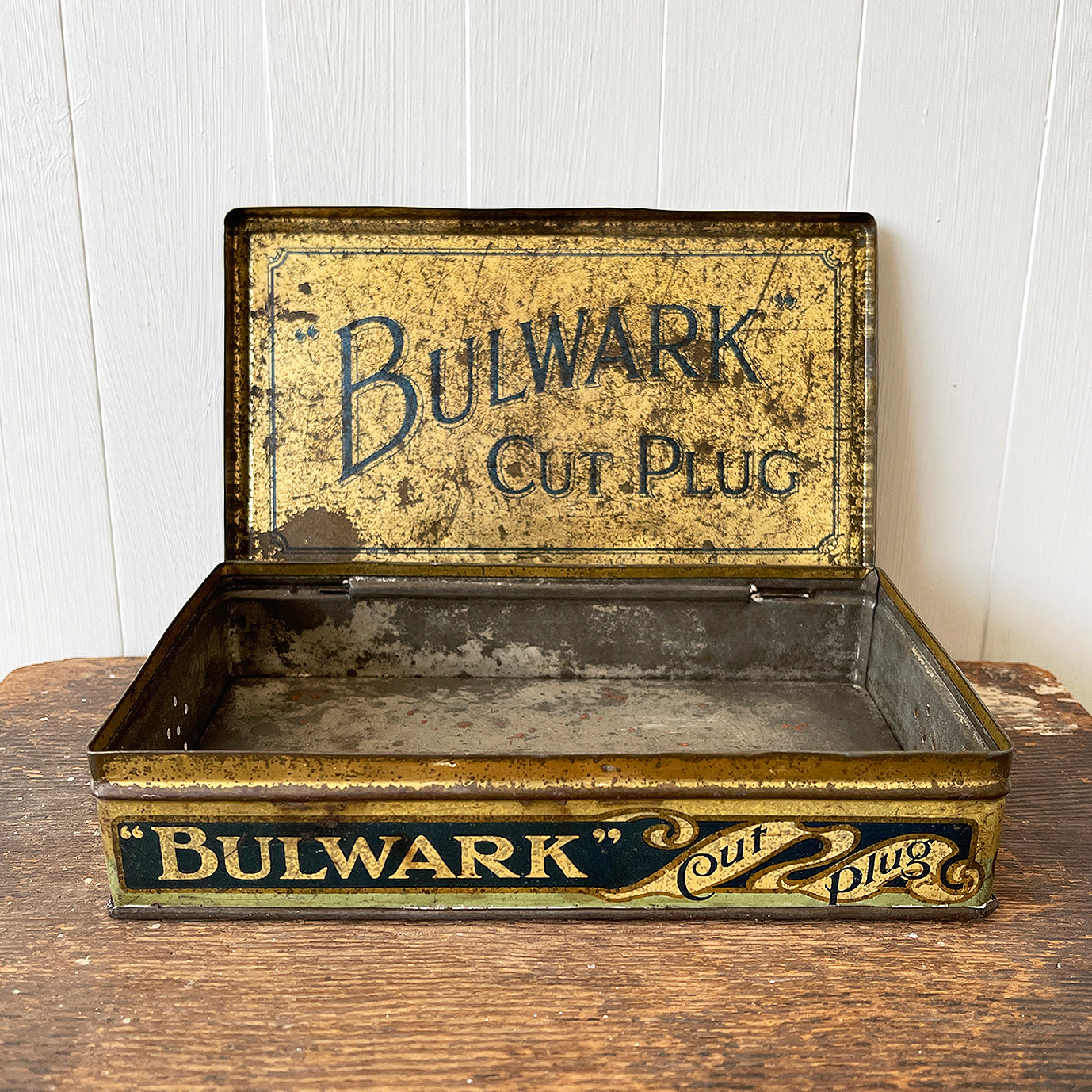Vintage Bulwark Cut Plug Tobacco Tin from W.D & H.O Wills, that would have held 1LB of tobacco. Great graphics to the front, sides with drilled air holes as part of the tin design. 
