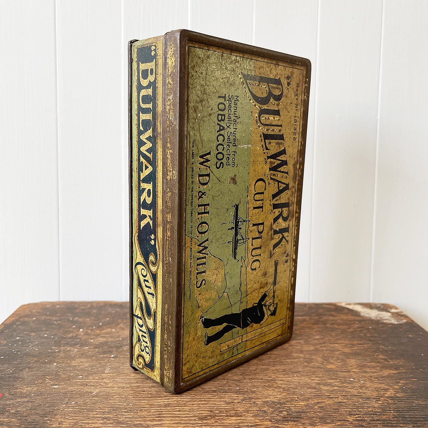 Vintage Bulwark Cut Plug Tobacco Tin from W.D & H.O Wills, that would have held 1LB of tobacco. Great graphics to the front, sides with drilled air holes as part of the tin design. 