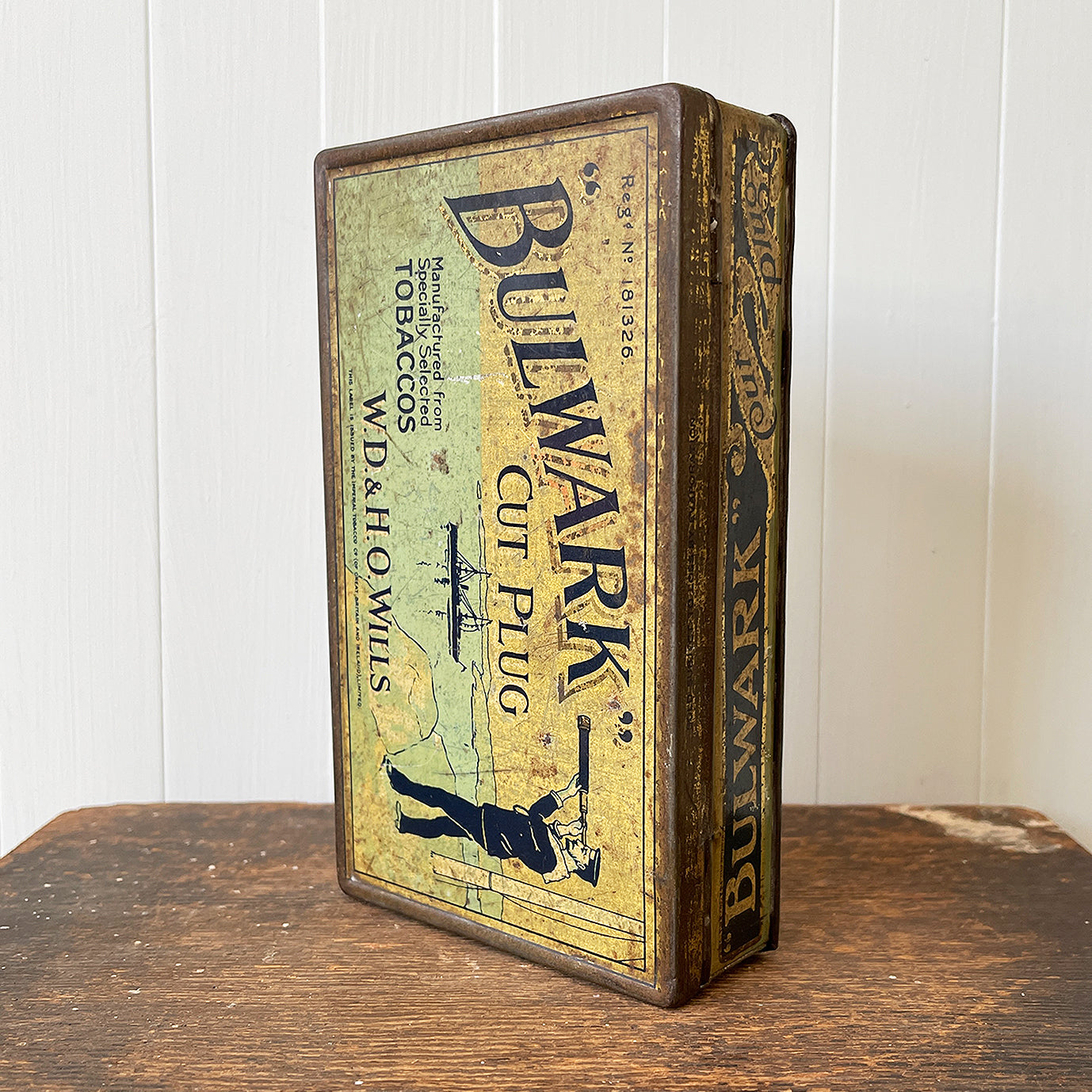 Vintage Bulwark Cut Plug Tobacco Tin from W.D & H.O Wills, that would have held 1LB of tobacco. Great graphics to the front, sides with drilled air holes as part of the tin design. 