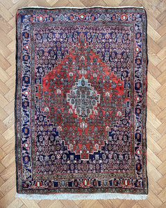 An antique Persian Heriz Carpet