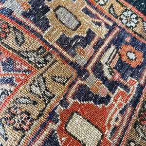 A beautiful, rich dark blue and red handmade Persian Heriz rug in wool. The overall condition is very good. With one pale blue central medallion decoration on a red diamond background framed by deep blue. A good practical size - SIZE: (L) 150cm   (W) 115cm - SHOP NOW www.intovintage.co.uk