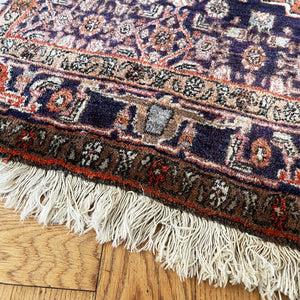 A beautiful, rich dark blue and red handmade Persian Heriz rug in wool. The overall condition is very good. With one pale blue central medallion decoration on a red diamond background framed by deep blue. A good practical size - SIZE: (L) 150cm   (W) 115cm - SHOP NOW www.intovintage.co.uk