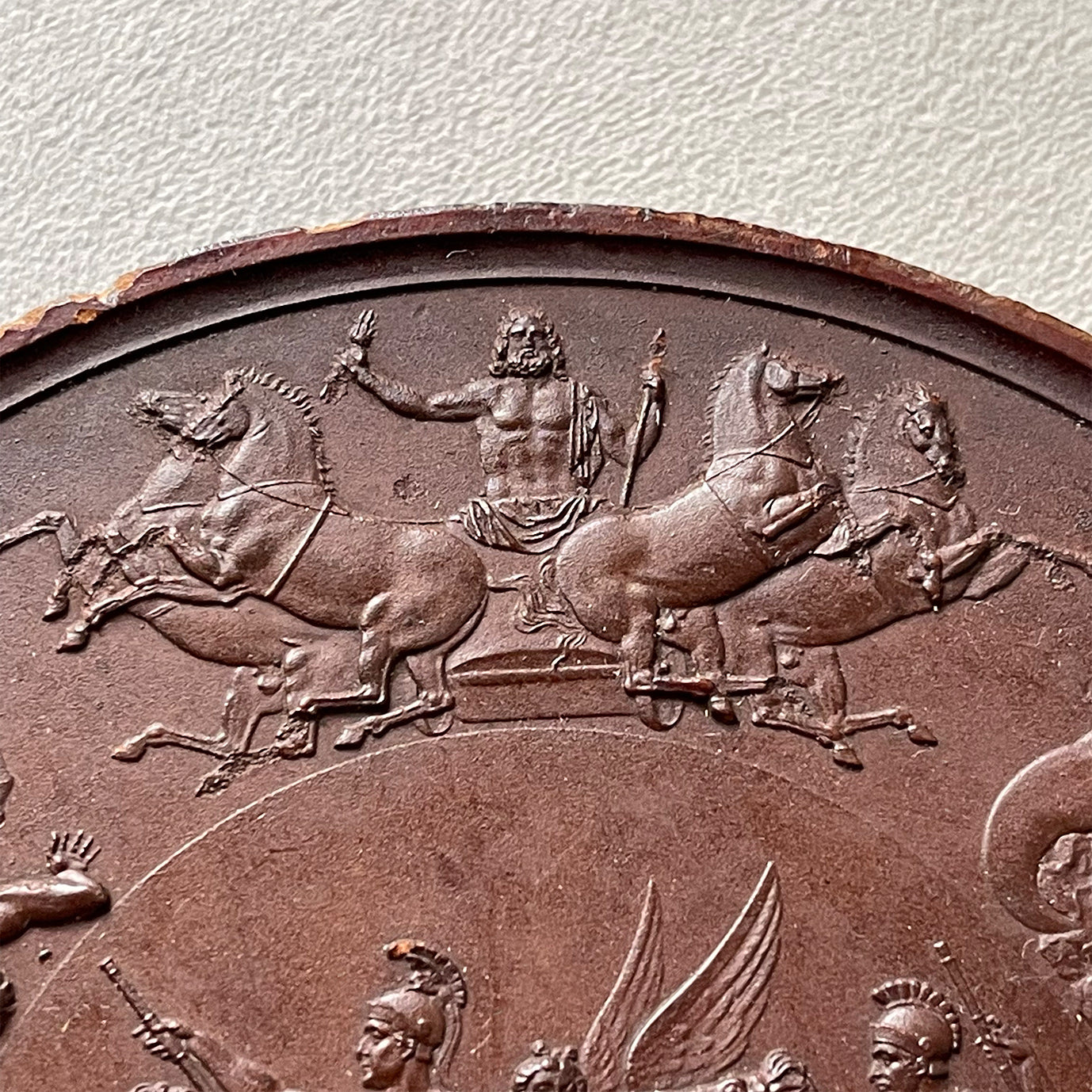 Detailed Victorian Plaster cast of the ancient battle of the Greek Gods and the Gigantes. The plaque shows serpent legged giants in battle whilst in the centre winged female god guides two soldiers on horseback. above them, in his chariot stands Zeus - SHOP NOW - www.intovintage.co.uk