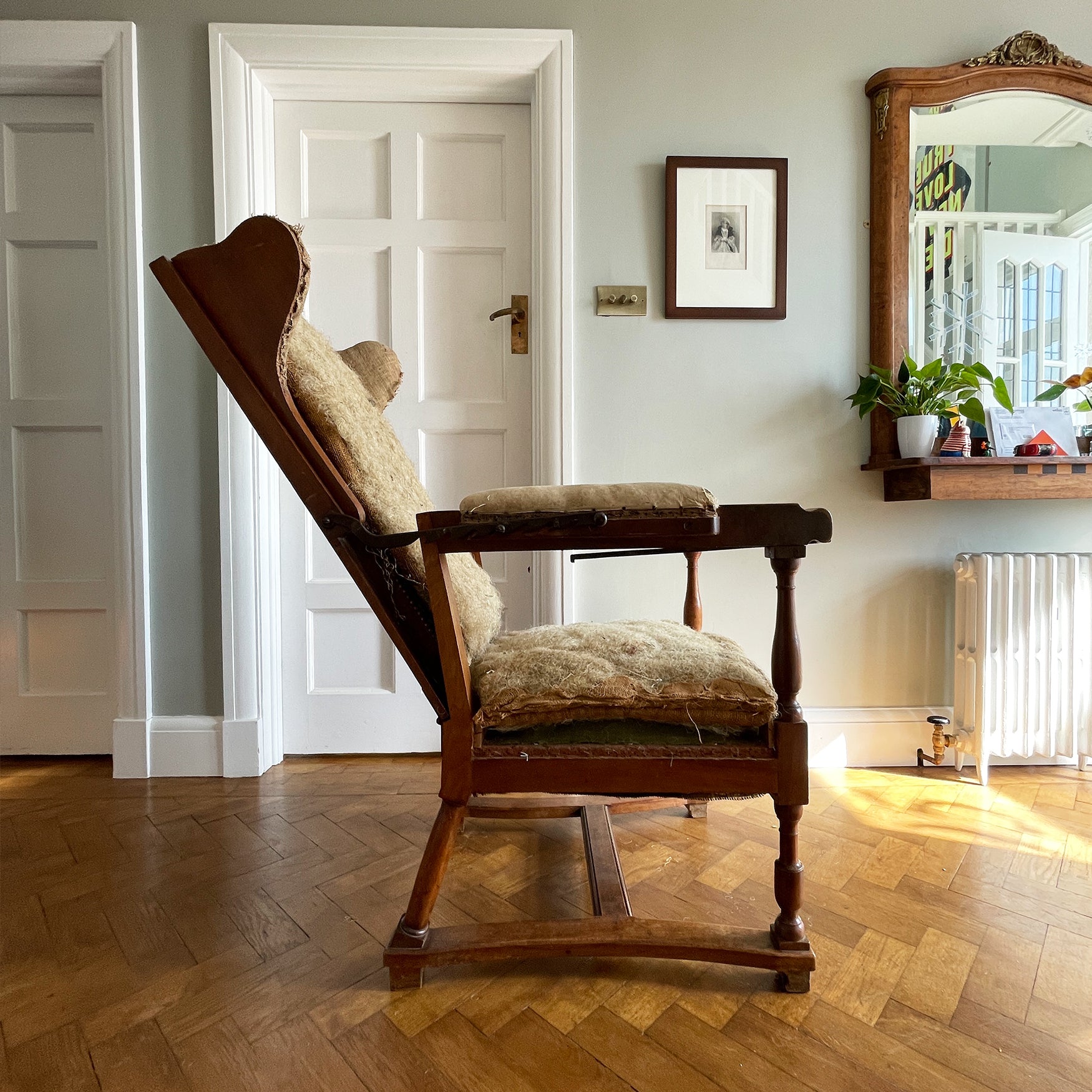A French Walnut Reclining Armchair Circa 1860. The wing back has seven adjustable positions activated via a simple iron ratchet system. The arms have extendable iron rods. Raised on turned legs with an 'H' shaped stretcher. With original horsehair & ready to be upholstered - SHOP NOW - www.intovintage.co.uk