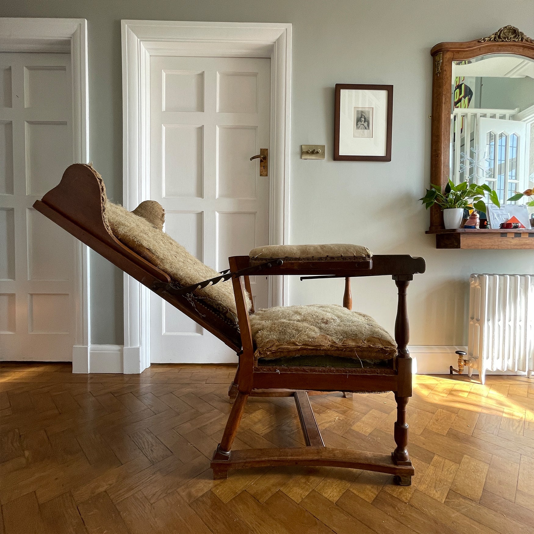 A French Walnut Reclining Armchair Circa 1860. The wing back has seven adjustable positions activated via a simple iron ratchet system. The arms have extendable iron rods. Raised on turned legs with an 'H' shaped stretcher. With original horsehair & ready to be upholstered - SHOP NOW - www.intovintage.co.uk