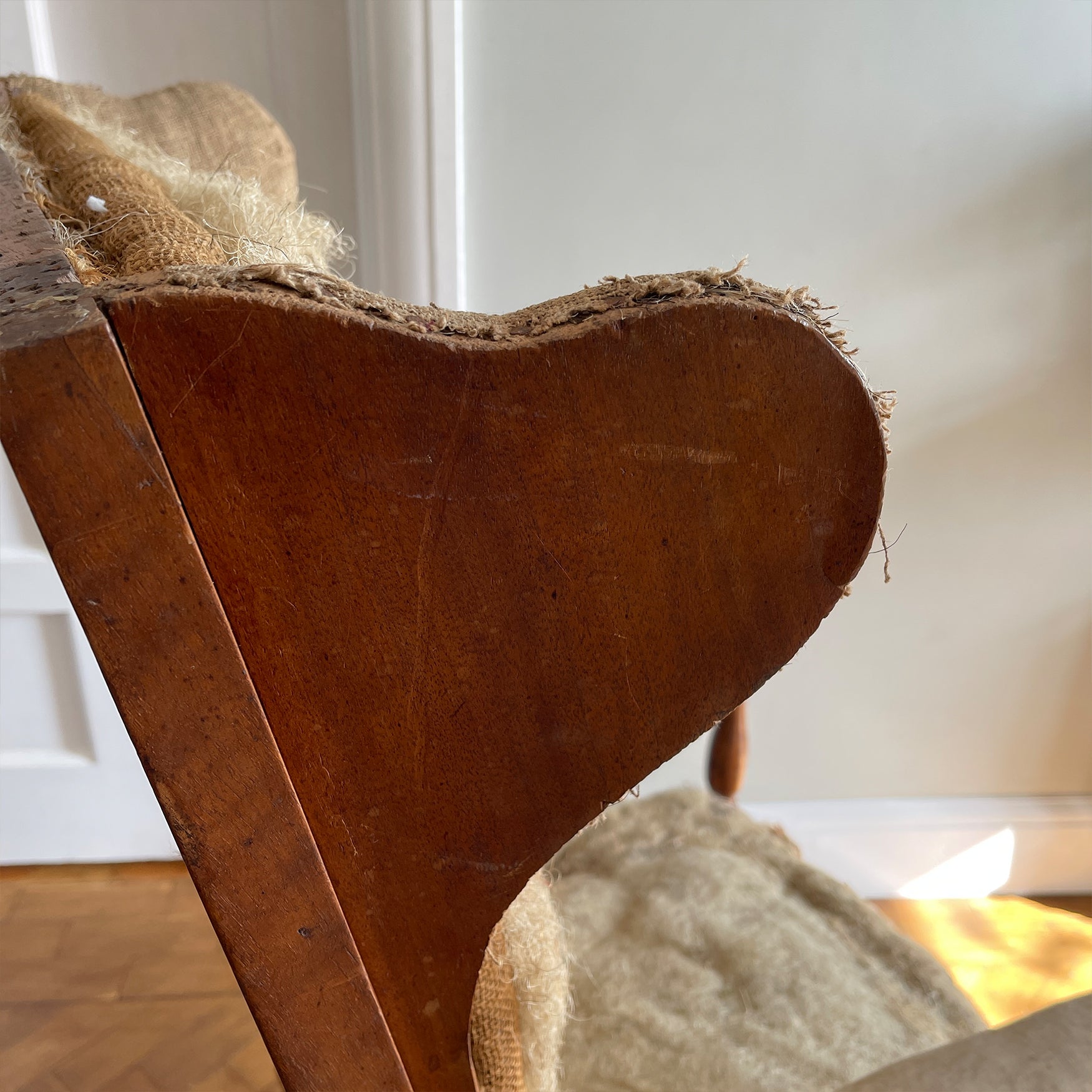 A French Walnut Reclining Armchair Circa 1860. The wing back has seven adjustable positions activated via a simple iron ratchet system. The arms have extendable iron rods. Raised on turned legs with an 'H' shaped stretcher. With original horsehair & ready to be upholstered - SHOP NOW - www.intovintage.co.uk