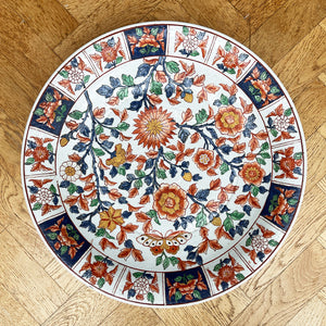 A large Oriental Charger Plate with colourful hand painted depictions of Chrysanthemum flowers and Butterfly. Decoration of flowers and signed to the underside. DIMENSIONS 47cm (Circumference) - SHOP NOW - www.intovintage.co.uk