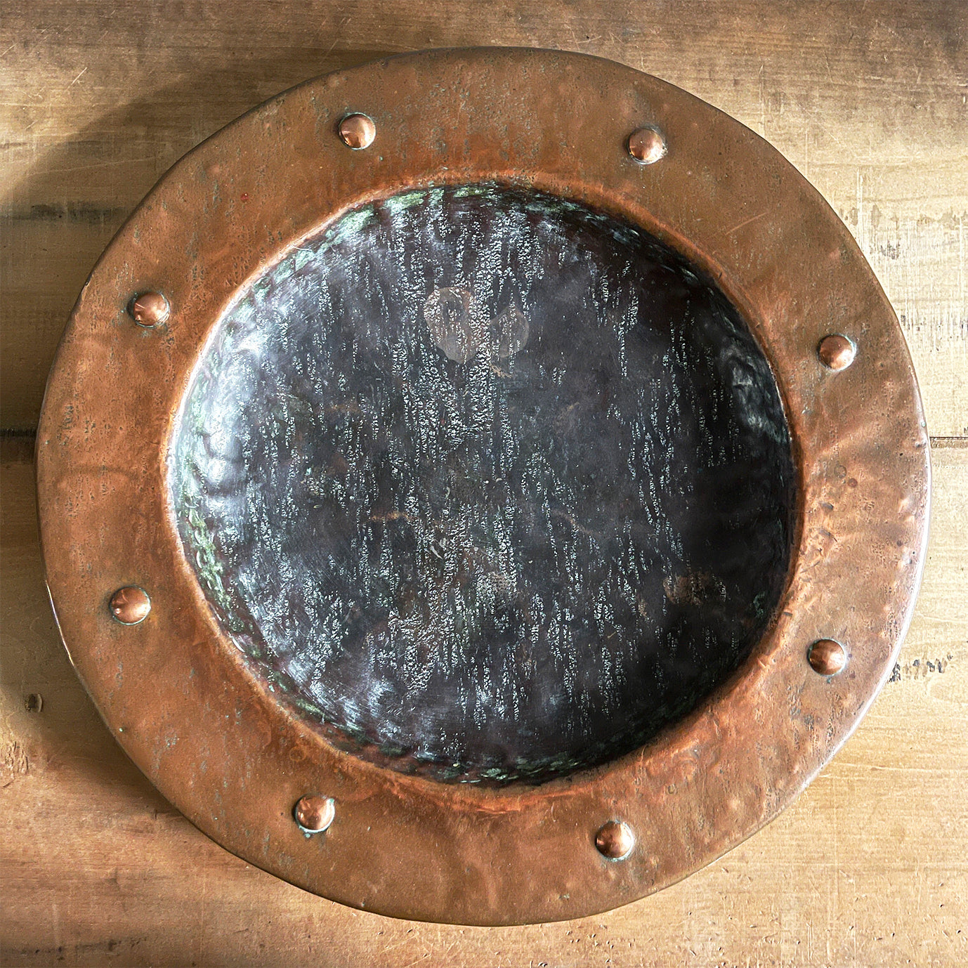 A large hand beaten Arts & Crafts Copper Charger in the Cornish Newlyn style. Beautiful colour and texture. Looks amazing as a table piece - SHOP NOW - www.intovintage.co.uk