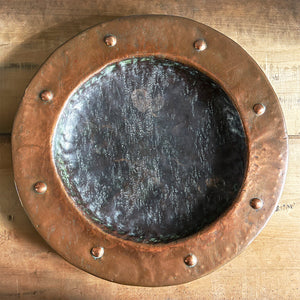 A large hand beaten Arts & Crafts Copper Charger in the Cornish Newlyn style. Beautiful colour and texture. Looks amazing as a table piece - SHOP NOW - www.intovintage.co.uk
