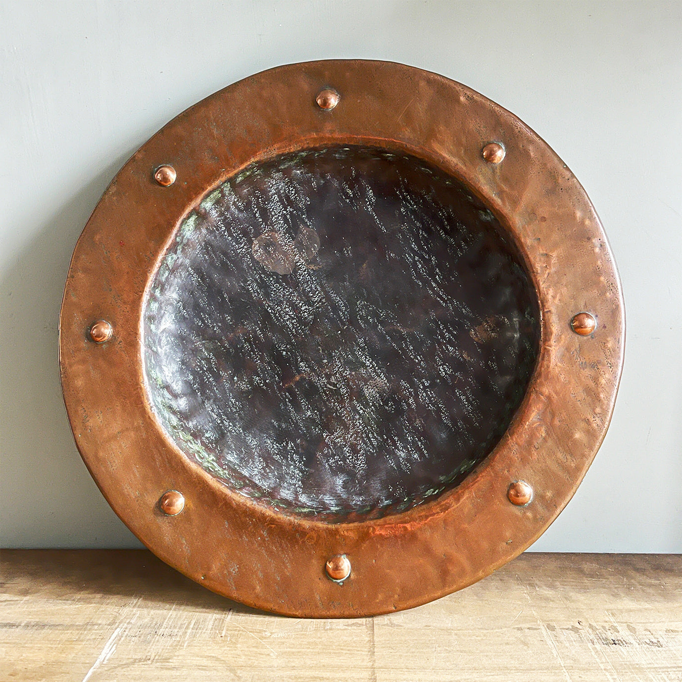 A large hand beaten Arts & Crafts Copper Charger in the Cornish Newlyn style. Beautiful colour and texture. Looks amazing as a table piece - SHOP NOW - www.intovintage.co.uk