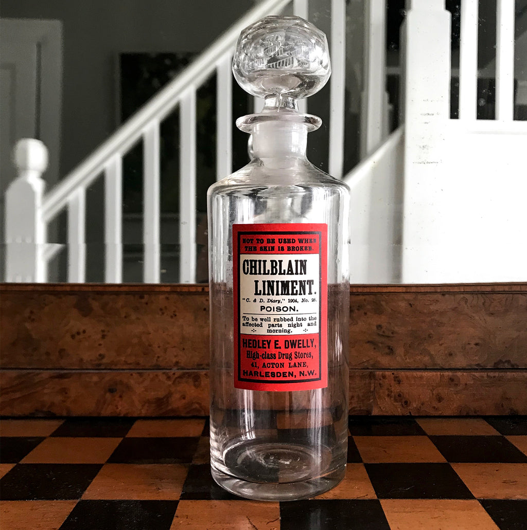 Vintage Apothecary Bottle with an original paper Poison label for Chilblain Liniment, Poison from Hedley E. Dwelly, High-Class Drug Stores, 41, Acton Lane, Harlesden. N.W. London - SHOP NOW - www.intovintage.co.uk