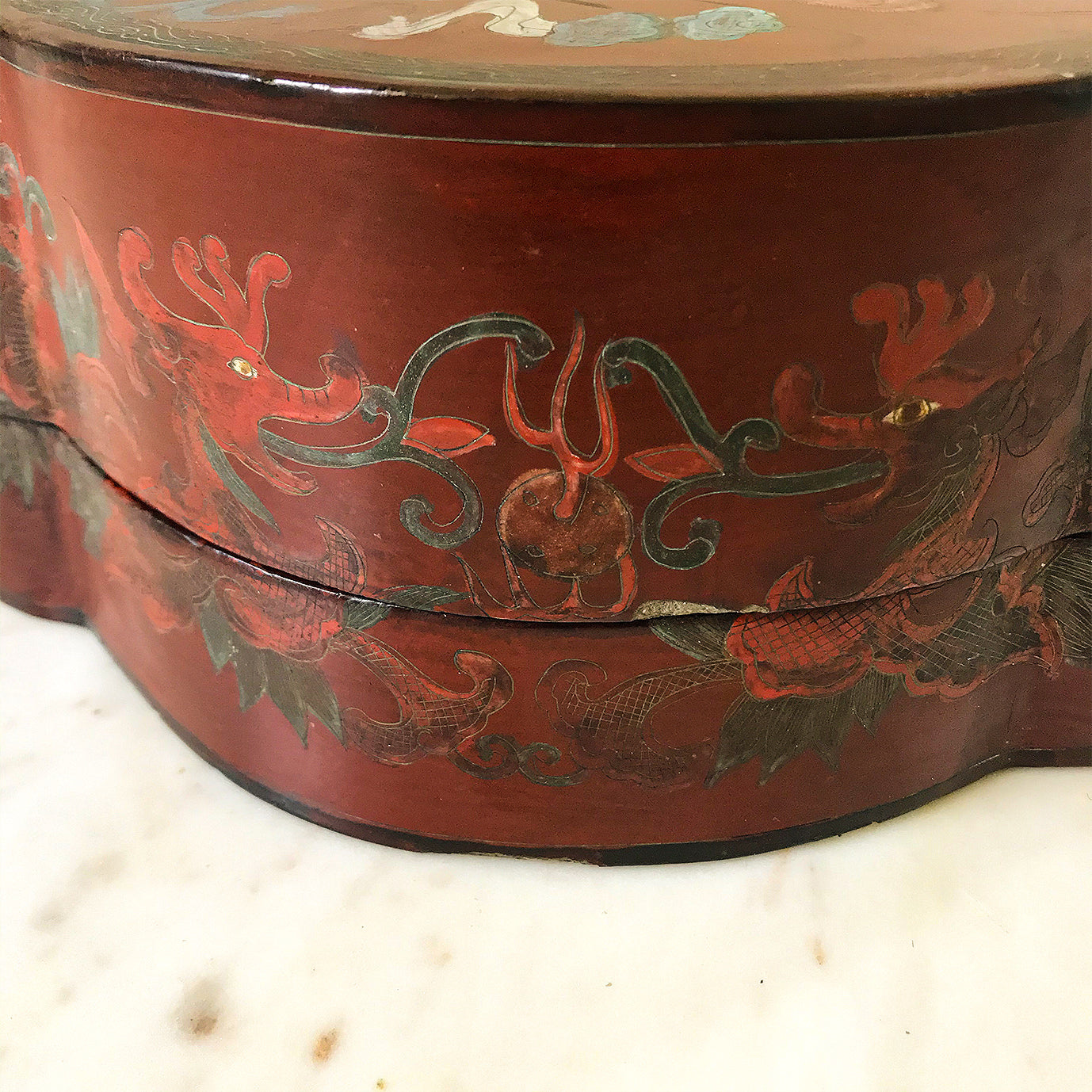 Chinese Red Lacquered Papier Mache Marriage Box. The box is decorated with Dragons & pheasants, a sign of good luck for the married couple. Gilt detail with the sides having an unusual scolloped shape adding to its country house look - SHOP NOW - www.intovintage.co.uk
