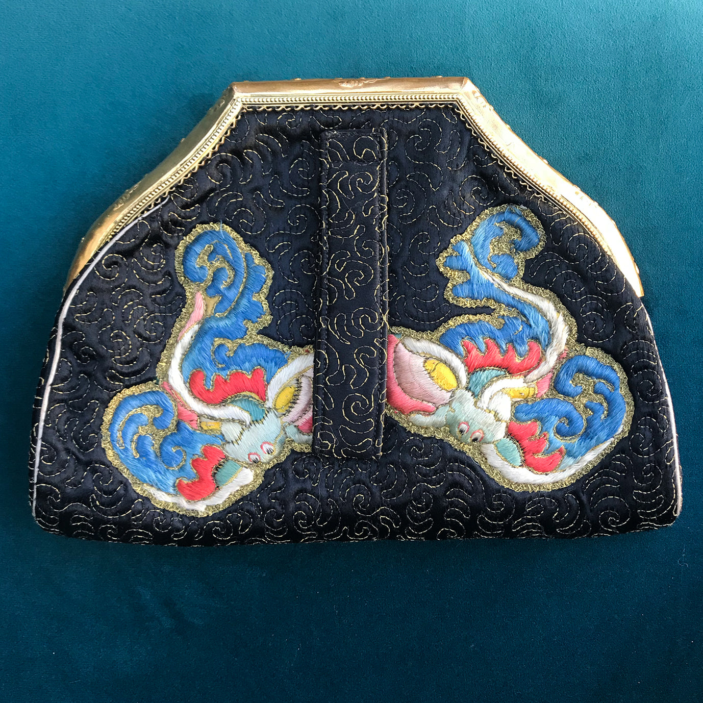 Exquisitely embroidered Vintage Chinese Silk Handbag with golden clasp in the most amazing original condition. The main body of the black bag is hand embroidered with a central silk Chinese figure surrounded by stylised embroidered silk dragons and flowers. It comes with its original silk purse and silk and kid leather lined mirror - SHOP NOW - www.intovintage.co.uk