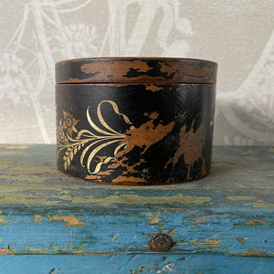 A delightful Oriental wooden Trinket box with lid. Decorated with a Pagoda scene to the lid, with the side having a floral fern decoration. The inside sees a brick red finish with flecks of gold. Great wear to the black paint around the edges on the outside - SHOP NOW - www.intovintage.co.uk