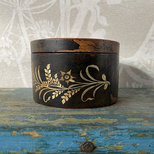 A delightful Oriental wooden Trinket box with lid. Decorated with a Pagoda scene to the lid, with the side having a floral fern decoration. The inside sees a brick red finish with flecks of gold. Great wear to the black paint around the edges on the outside - SHOP NOW - www.intovintage.co.uk