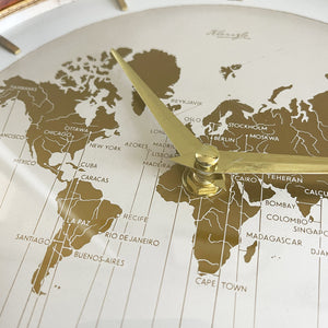 An impressive mid 20th Century World Timer mantel or table clock by Kienzle, Germany with the very rare teak wood surround. The face depicts the countries of the world showing the different time zones - SHOP NOW - www.intovintage.co.uk