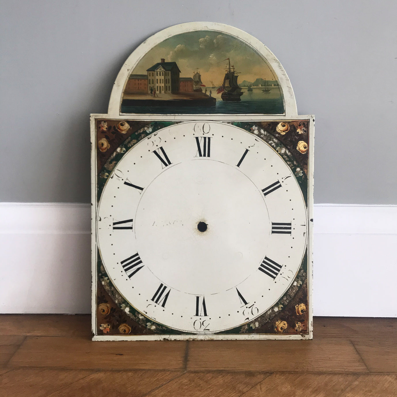 Beautiful Antique Clock Face by Johnson of Knaresboro. It has a charming harbour scene with a couple strolling along a period waterside quay and two naval frigates in full sail showing the Royal Navy flag - SHOP NOW - www.intovintage.co.uk