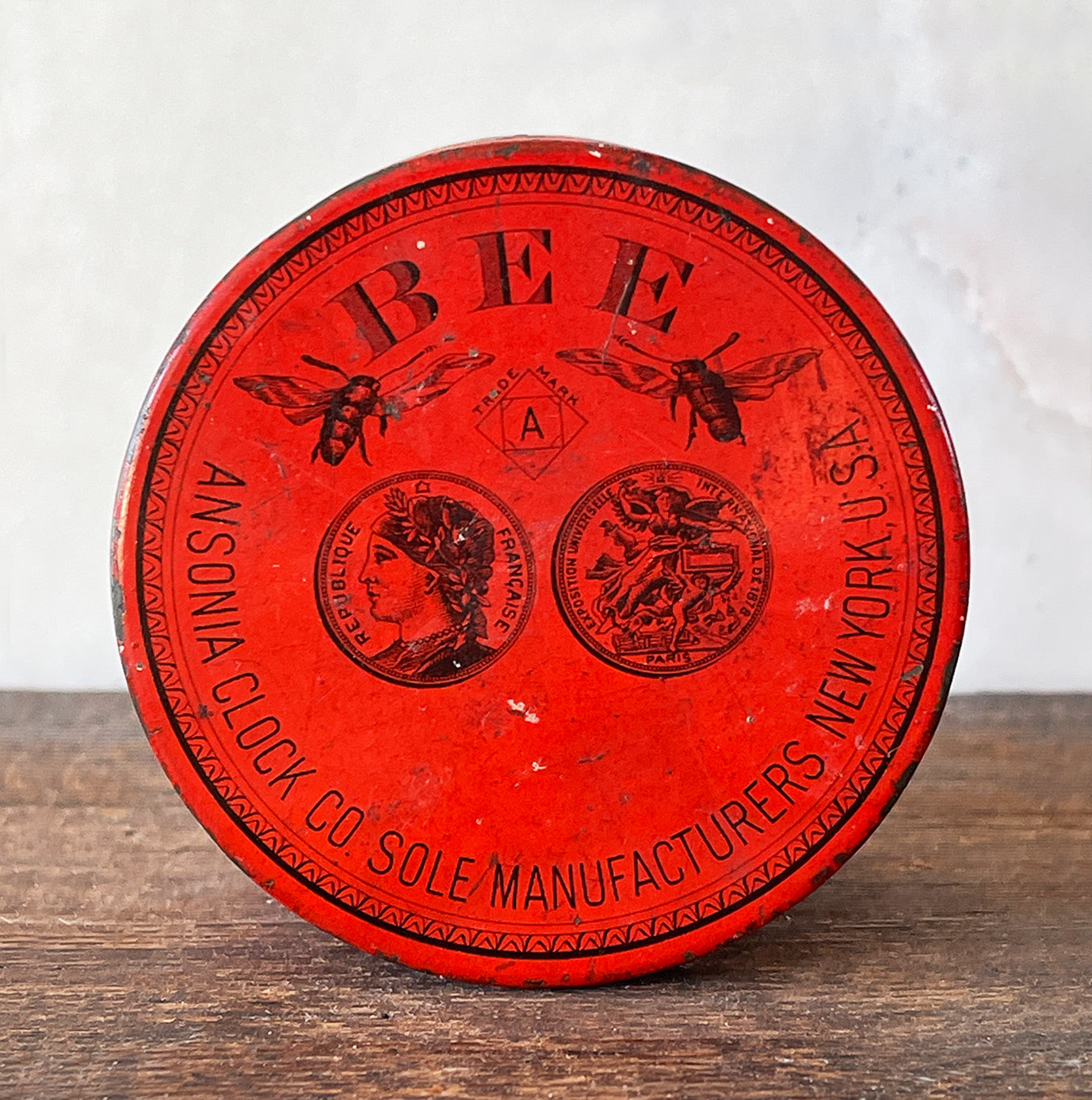 A sort after Vintage Anosonia Clock Tin by the Anisonia Clock Company of Brooklyn, New York. The tin was used to house the 'BEE' clock which required no key, all you had to do was twist its back - SHOP NOW - www.intovintage.co.uk