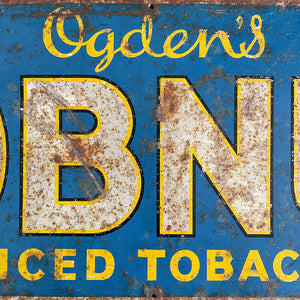 A 1930s Ogden's Cob Nut Sliced Tobacco Tin Sign. In a fantastic bright blue with yellow and black highlights around white type.warm yellow with dark blue type. - SHOP NOW - www.intovintage.co.uk