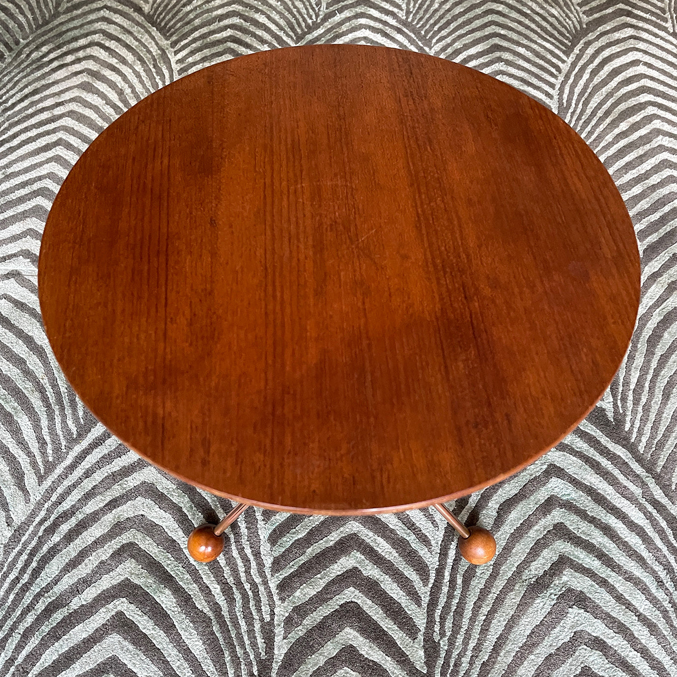 A mid century copper legged occasional table. Crafted from quality teak and copper. The slender copper legs finished in vey cool teak ball feet - SHOP NOW - www.intovintage.co.uk