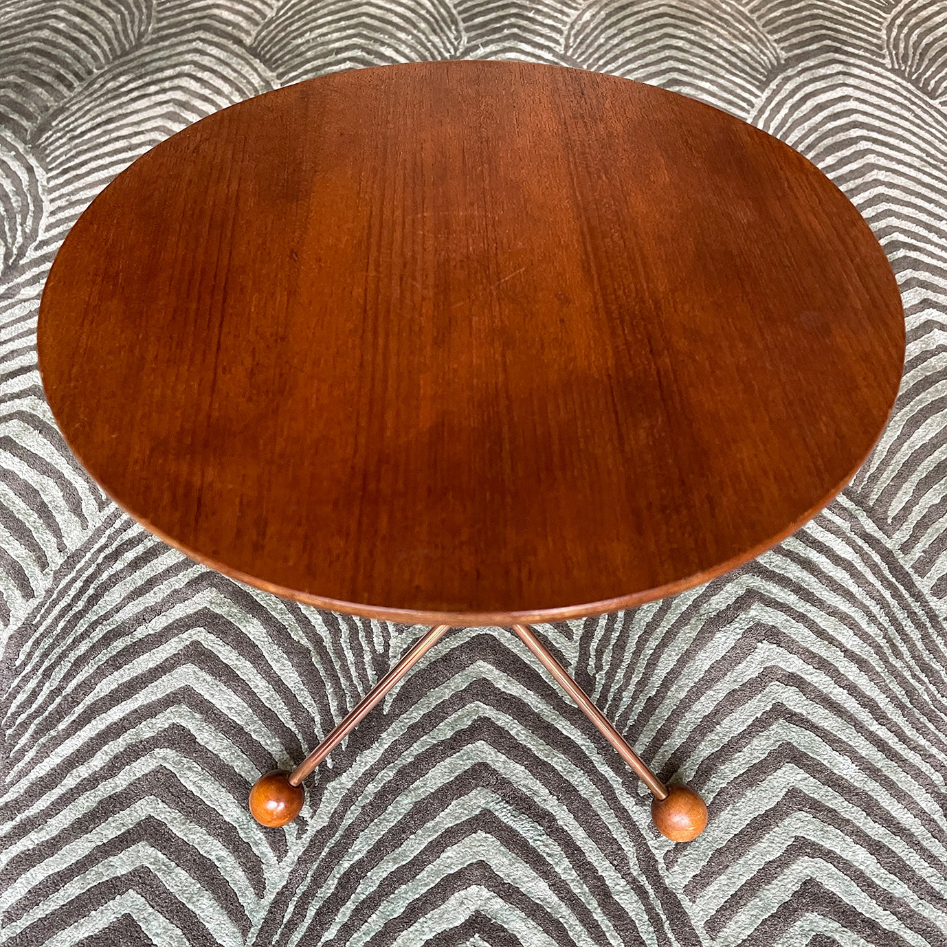A mid century copper legged occasional table. Crafted from quality teak and copper. The slender copper legs finished in vey cool teak ball feet - SHOP NOW - www.intovintage.co.uk